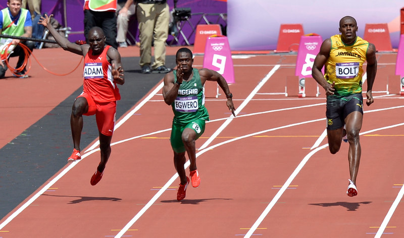 Illustration for article titled Photos Of Usain Bolt Looking Bored As He Blows Past The Best Runners In The World